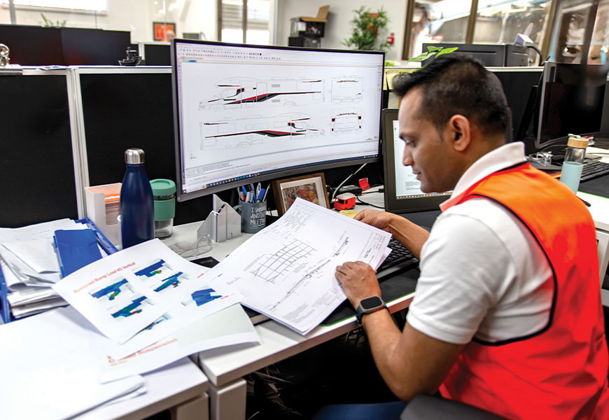 An Apollo engineer working on designing a Winnebago motorhome at the Apollo manufacturing warehouse in Brisbane, Australia.